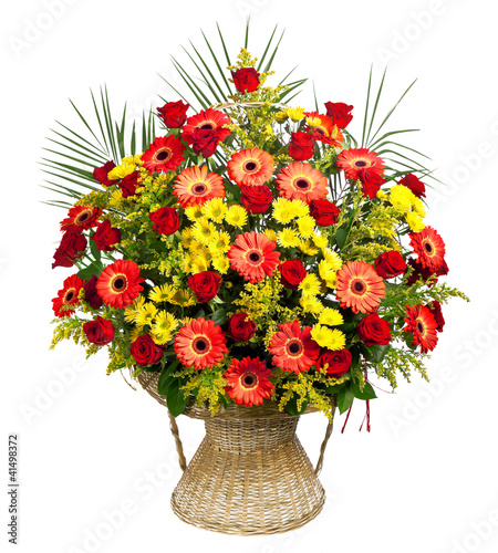 basket of roses, gerberas and palm leaves