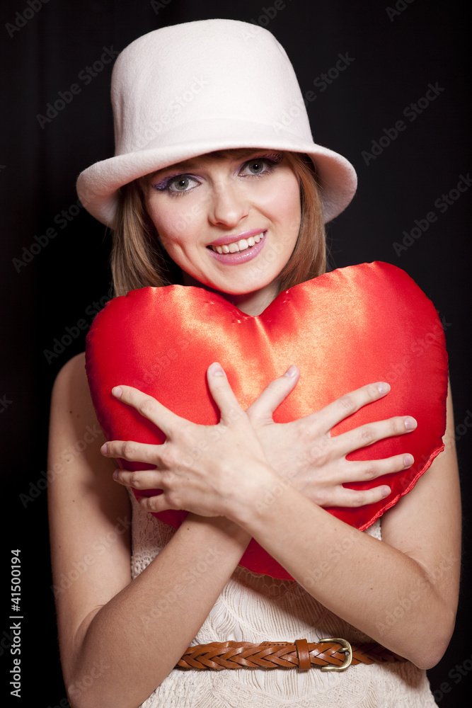 Portrait of beautiful redhead girl with toy heart. Portrait of beautiful redhead girl with toy heart.