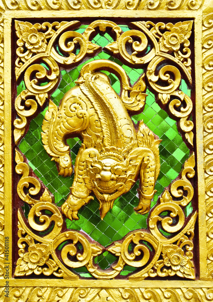Animal carvings on the doors of the temple in the novel in a Tha