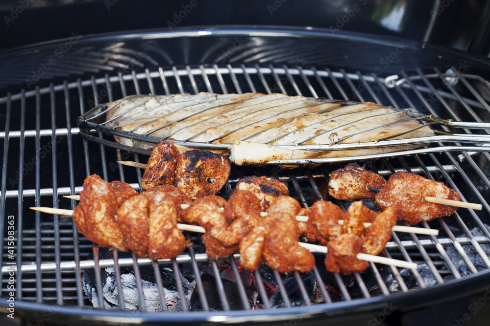 Swordfish and Chicken Skewers on Grill Cooking Swordfish and Chicken Skewers on Grill Cooking