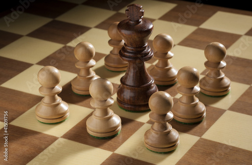 Chess pawns around the king