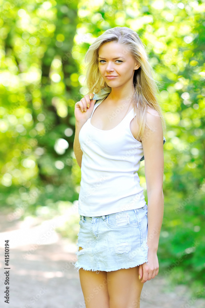 Romantic young woman posing outdoors Romantic young woman posing outdoors