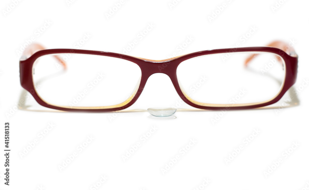 Fototapeta premium Glasses with a contact lens isolated on white
