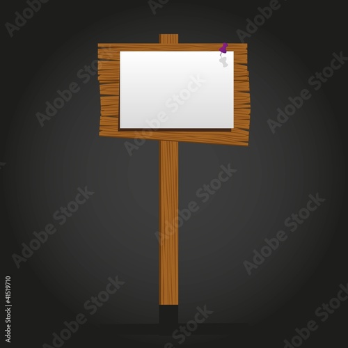 wooden signage with a paper