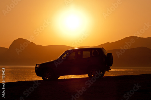 car on sunset background © Pavlo Klymenko
