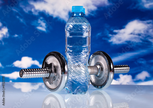 fitness dumbbells and water