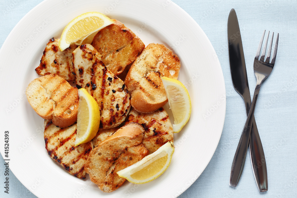 Grilled lemon chicken with garlic bread