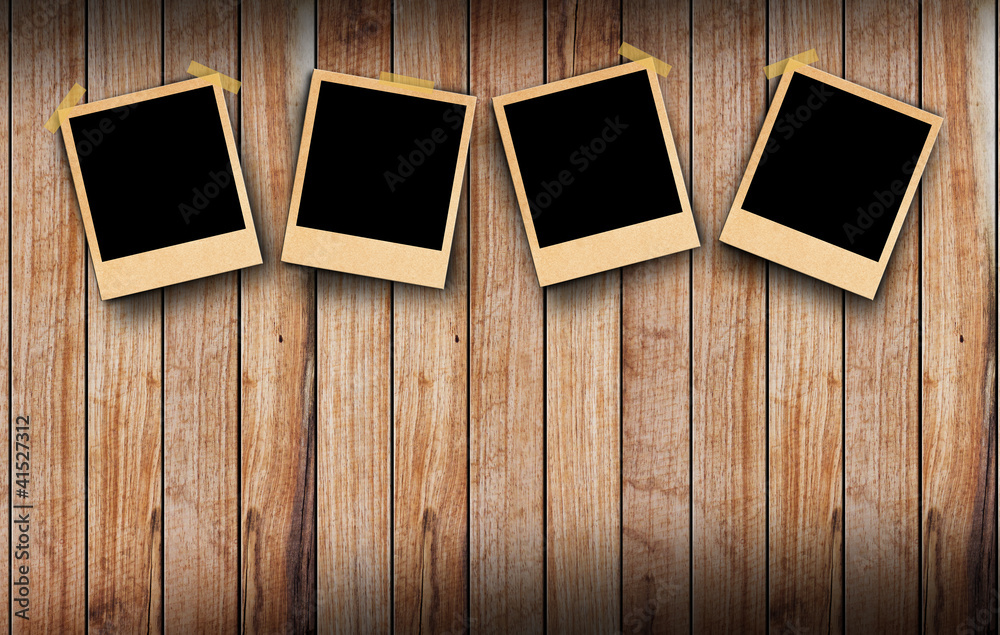 Blank instant photo frames on old wooden background. Blank instant photo frames on old wooden background.