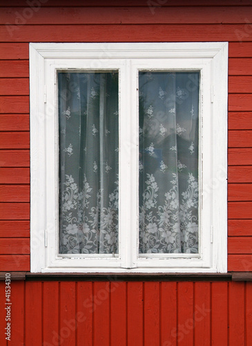 Window on old stylish wooden wall