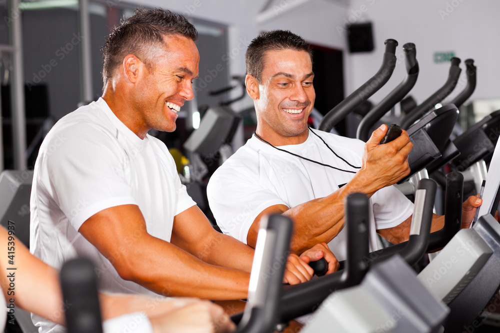 fitness man and personal trainer in gym fitness man and personal trainer in gym