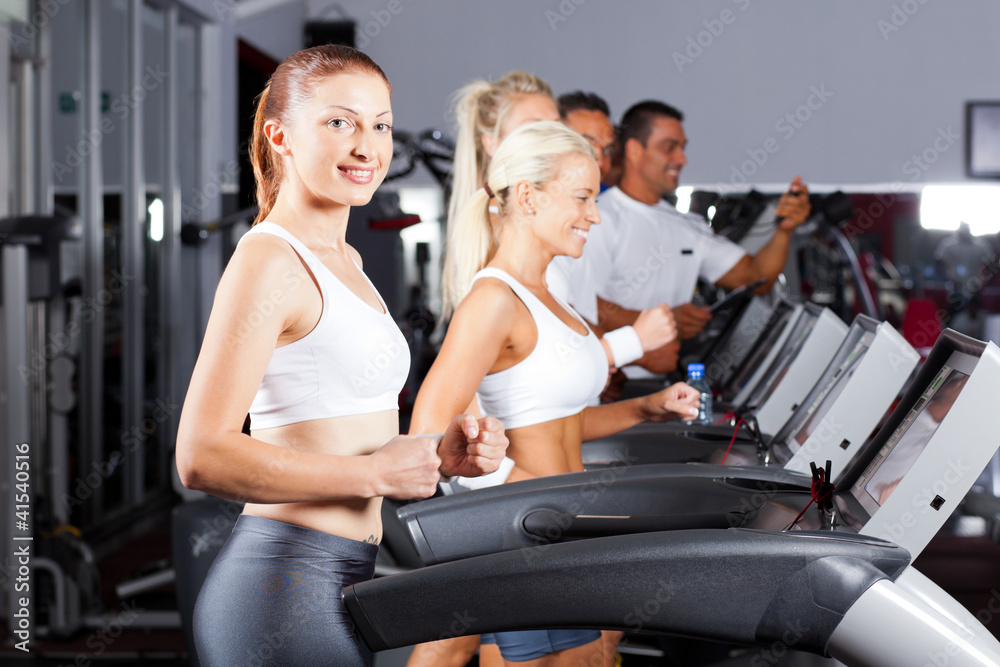 fitness people running on treadmill in gym