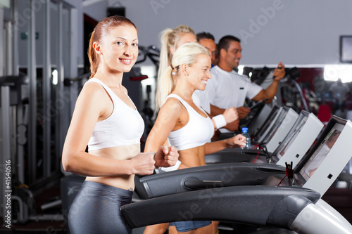 fitness people running on treadmill in gym