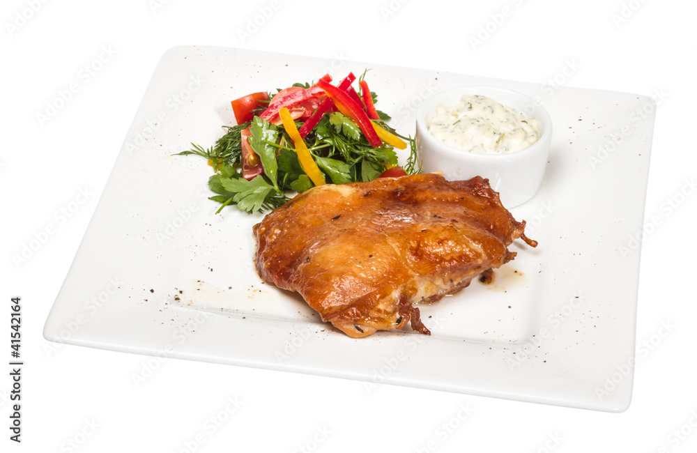 roasted chicken with vegetables on a white plate