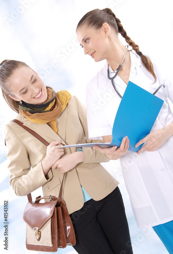 Female medical doctor and her patient discuss test results