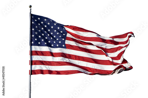 Large U.S. Flag "Old Glory" blowing in a strong wind on a cloudl