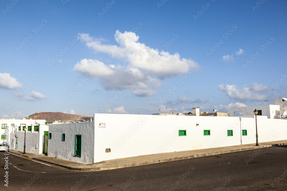 facade of mediterranean house with closed shutterblinds facade of mediterranean house with closed shutterblinds