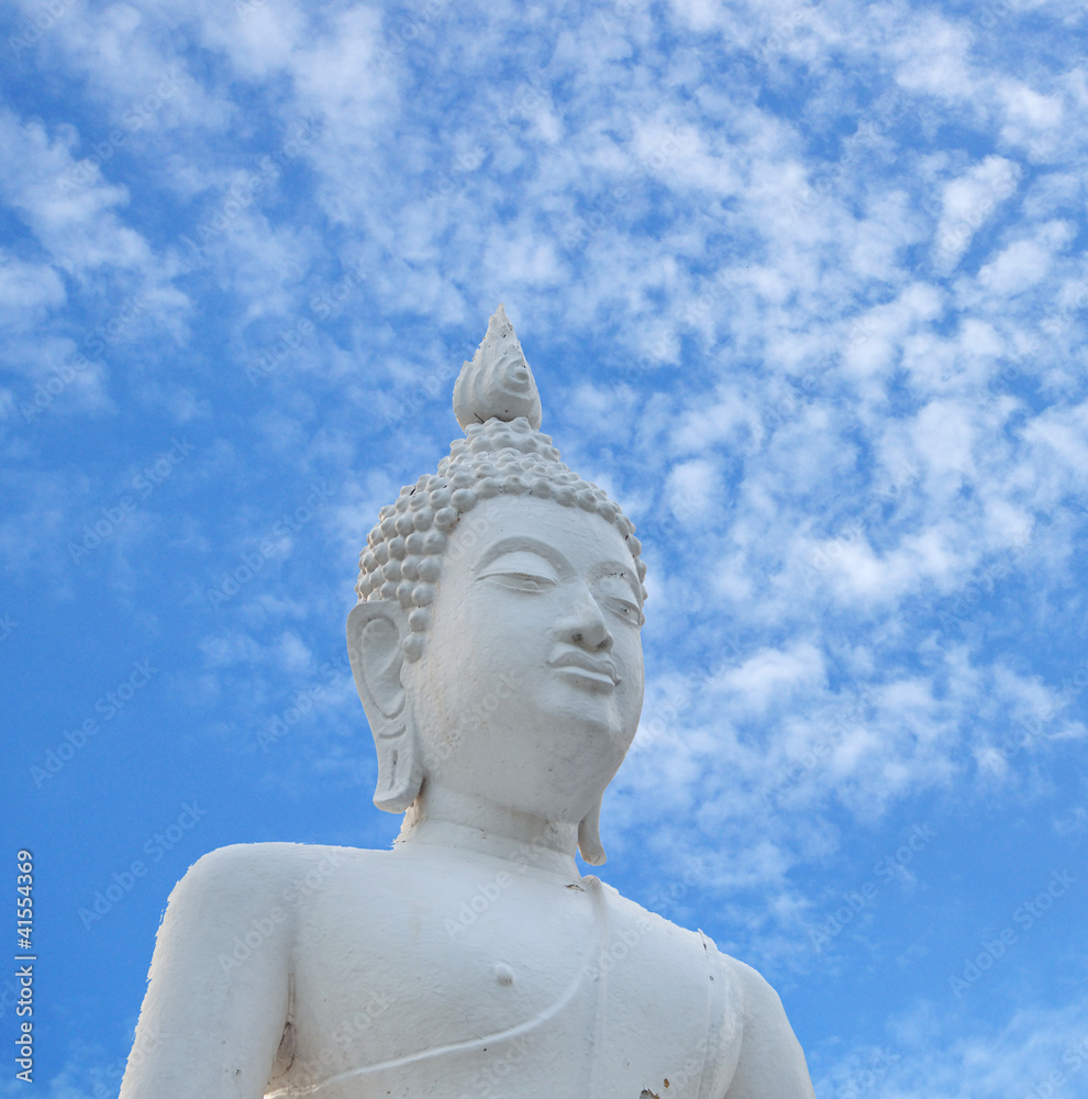 White Buddha statue and blue sky White Buddha statue and blue sky
