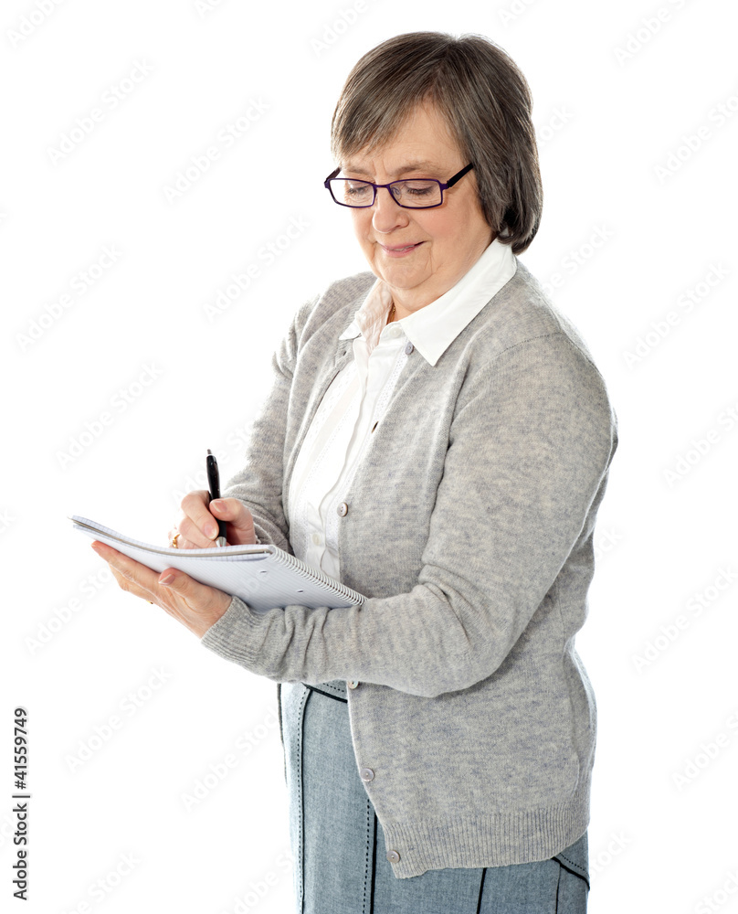 Portrait of a businesswoman writing notes Portrait of a businesswoman writing notes