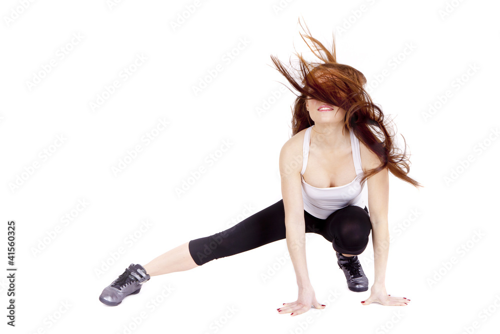 Young woman stretching muscles and tendons during exercise.