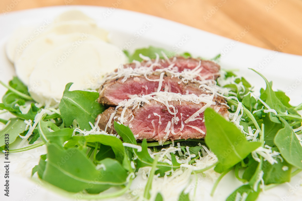 Fresh grilled beef steak on white plate close up