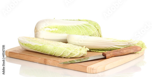 Chinese cabbage on wooden chopping board isolated on white