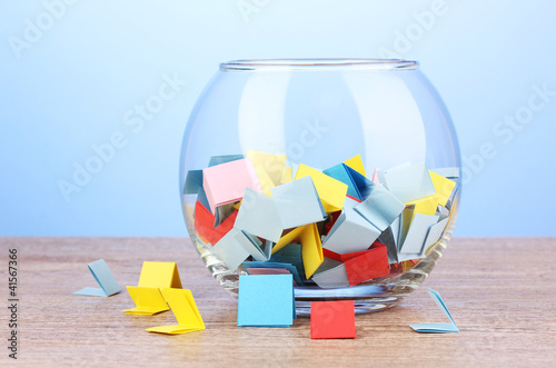 Pieces of paper for lottery in vase