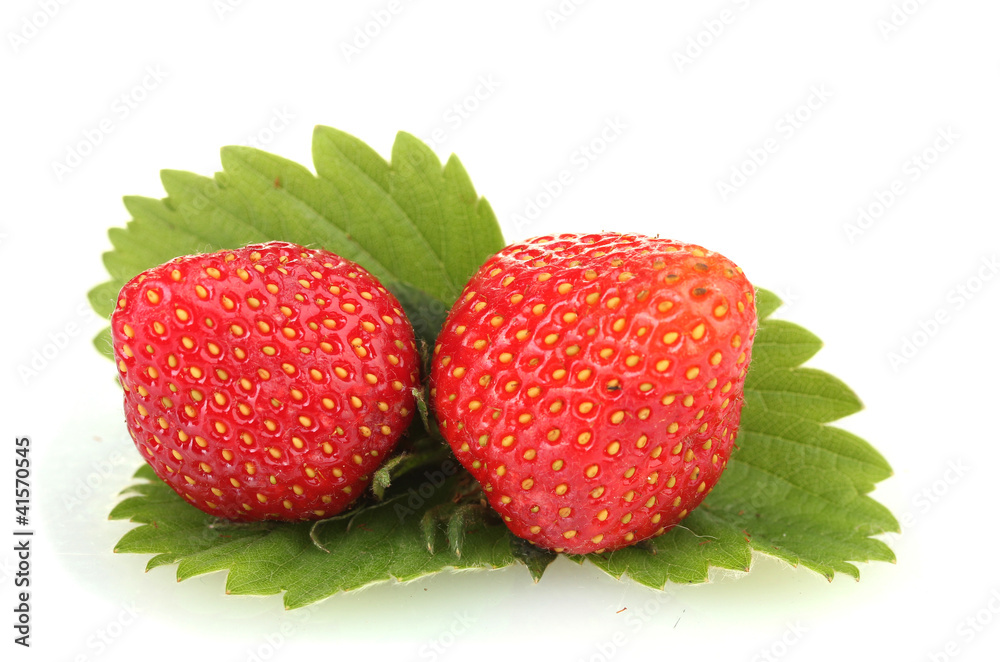 sweet ripe strawberries with leaves isolated on white