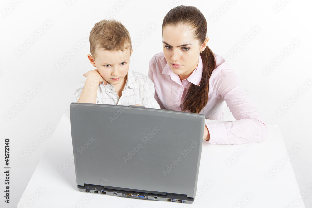 Boy and woman sit at the laptop. Boy and woman sit at the laptop.