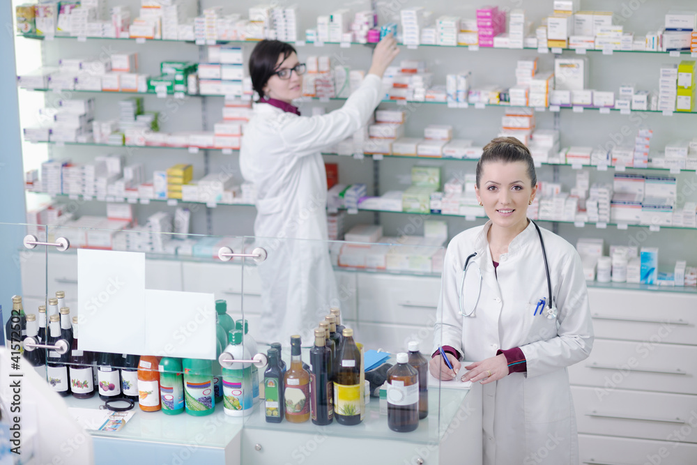 team of pharmacist chemist woman  in pharmacy drugstore