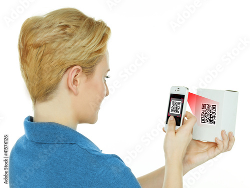Woman scans a scancode with her white cellphone photo