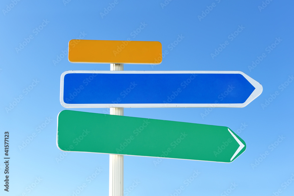 Arrow sign against sky Arrow sign against sky