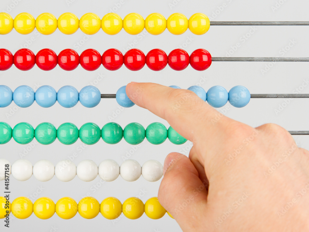 A man using an abacus on a white background A man using an abacus on a white background