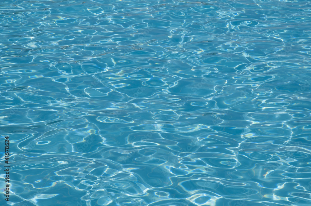 Reflection of sun in pool water