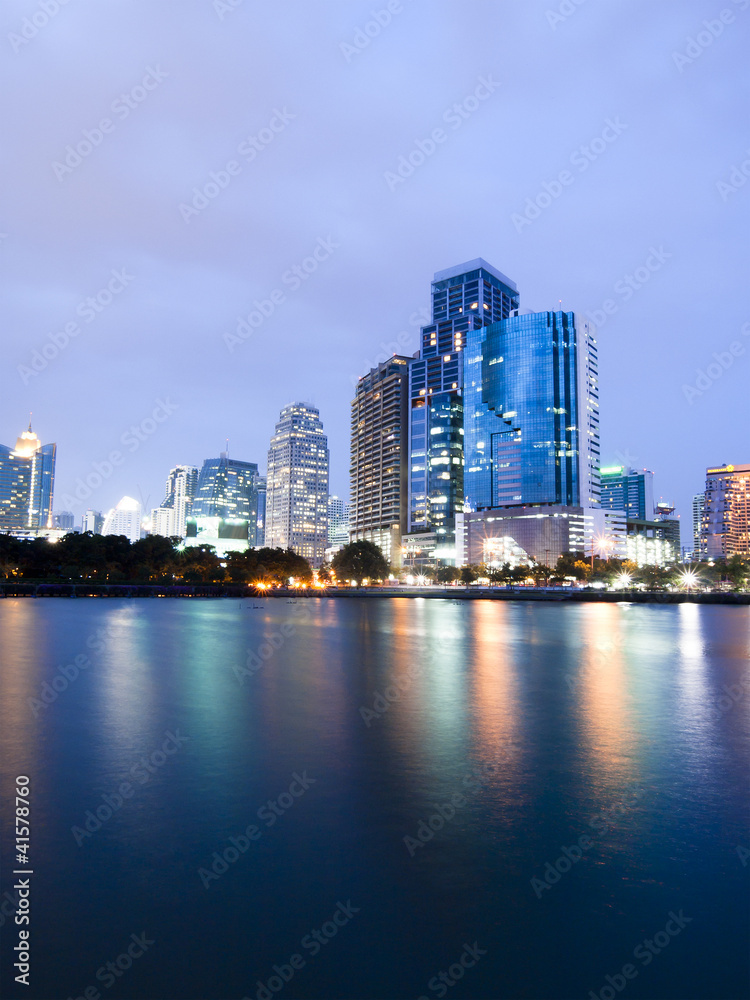 Naklejka premium Bangkok city downtown at night with reflection of skyline, Bangk
