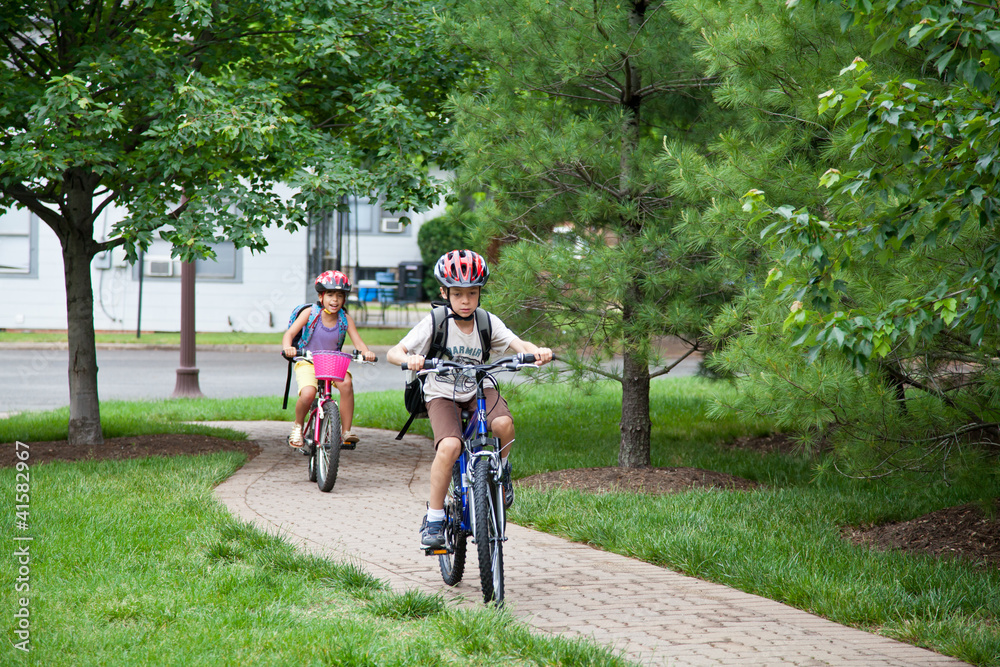 Obraz premium Kids Biking to School