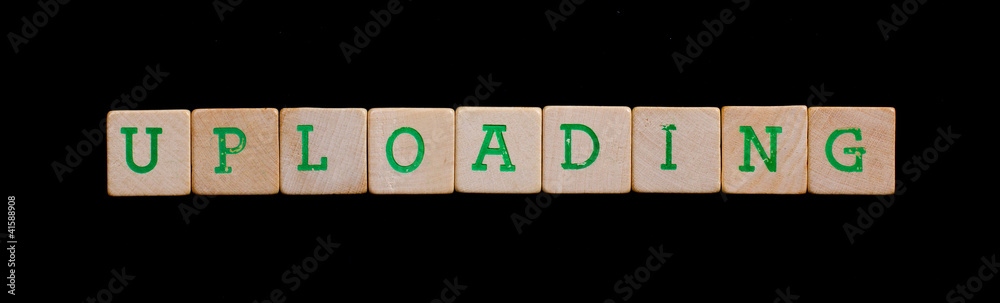 Green letters on old wooden blocks (uploading) Green letters on old wooden blocks (uploading)