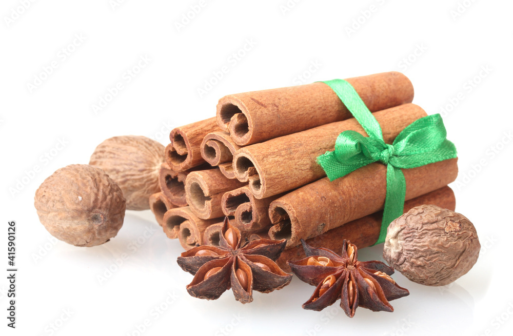 Cinnamon sticks, nutmeg and anise isolated on white Cinnamon sticks, nutmeg and anise isolated on white