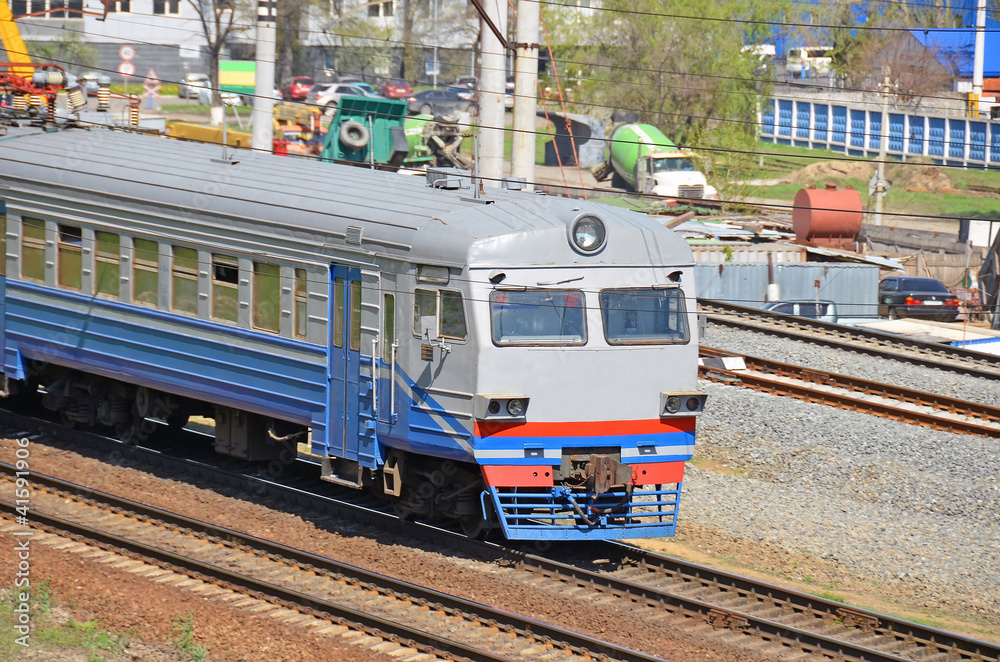 Fototapeta premium Suburban electric train locomotive in industrial zone