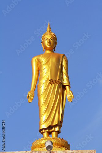 Golden standing Buddha statue