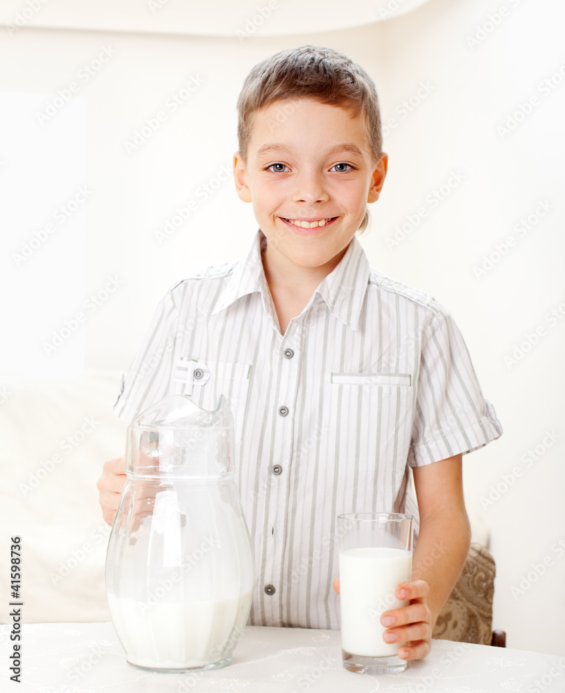Child with glass pitcher milk