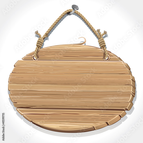 Wooden sign with rope hanging on a nail.