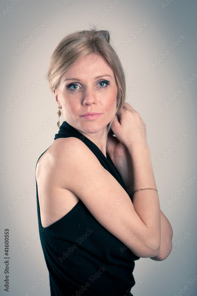 Beautiful blonde caucasian woman with elegant black dress. Beautiful blonde caucasian woman with elegant black dress.