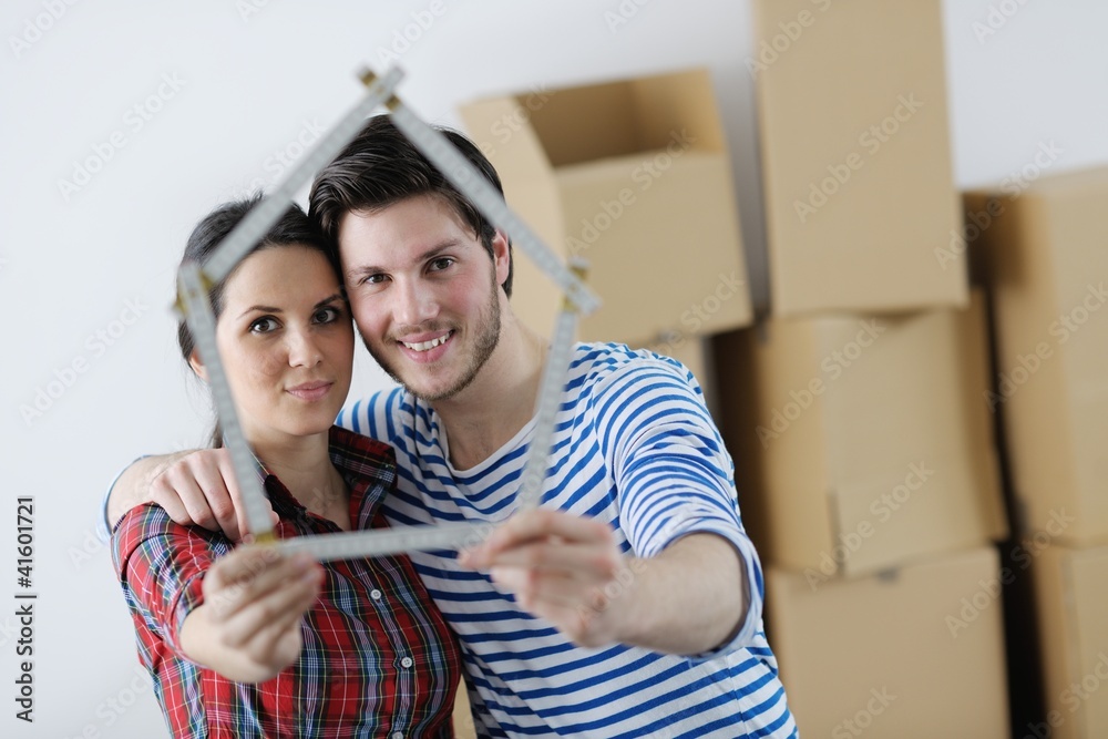 Young couple moving in new house Young couple moving in new house