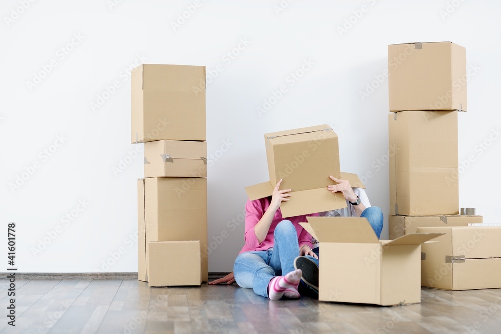 Young couple moving in new house Young couple moving in new house