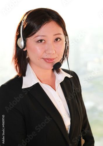 Business girl with headphones / Japan