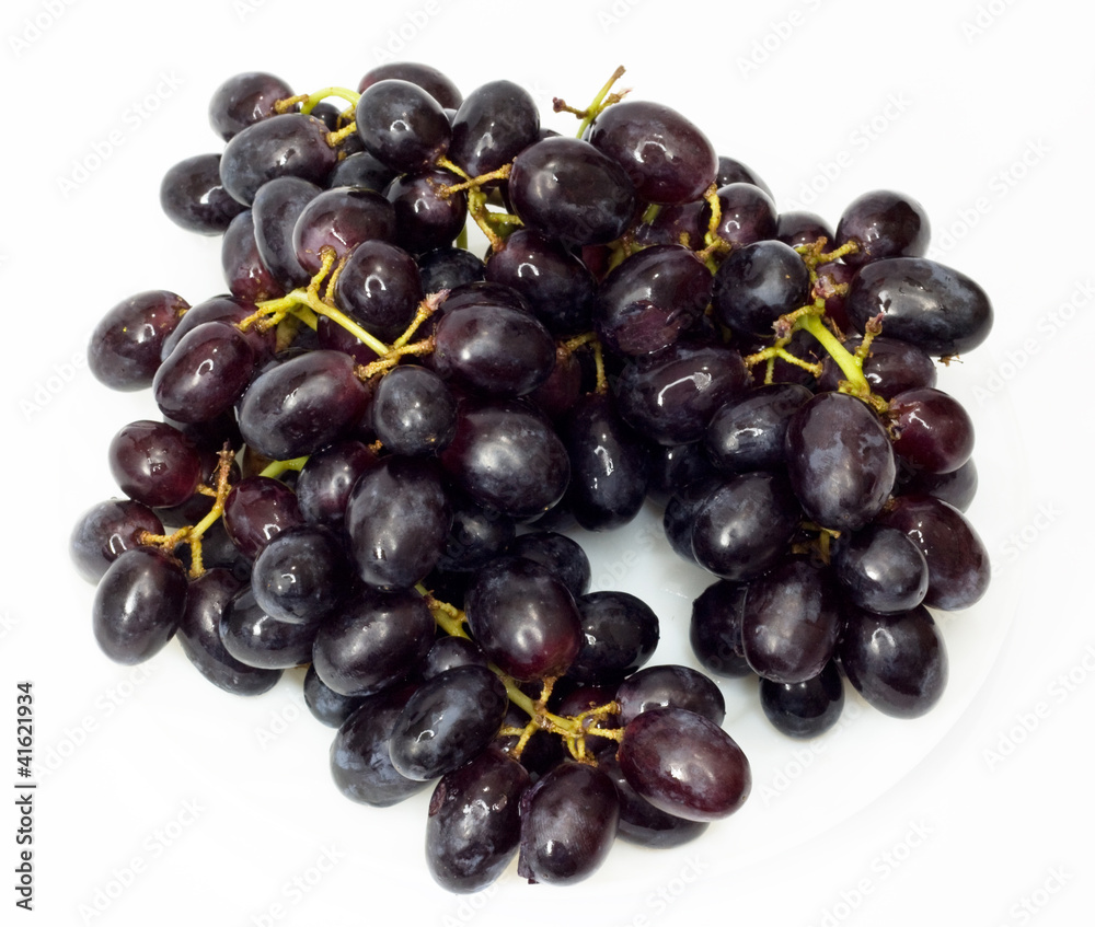 Bunch of black grapes isolated on white background Bunch of black grapes isolated on white background