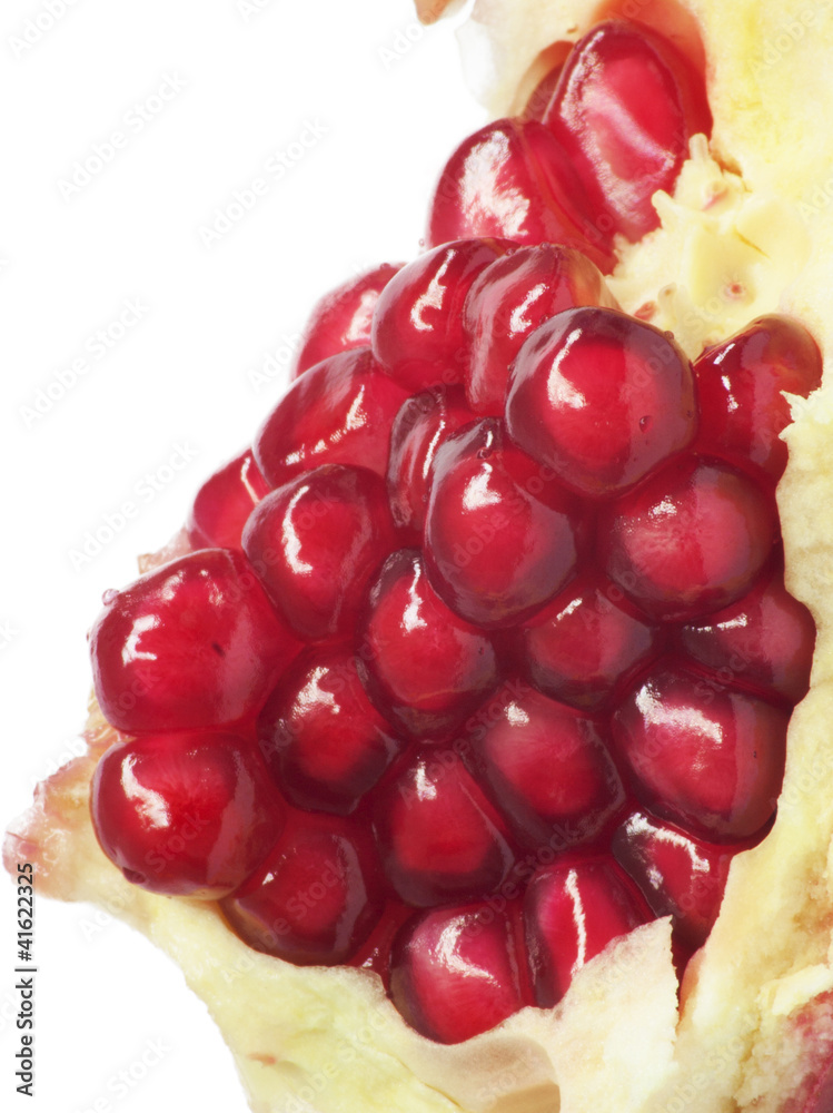 Extreme close up background of a red juicy ripe pomegranate frui