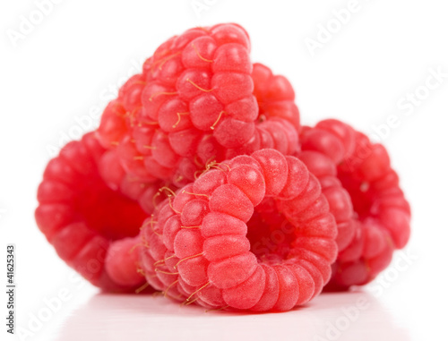 ripe red raspberry on white