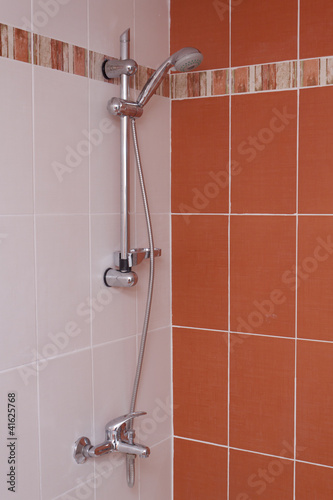 Red bathroom interior. Tap and shawer. photo