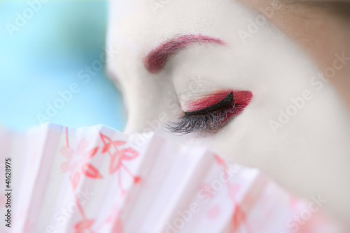 Canvas-taulu Fragment of a face of woman with geisha makeup (blue)